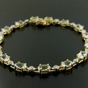 14 Karat Gold Bracelet with Blue Topaz & Diamonds